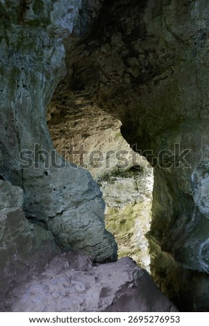 Cave with light shining though from back