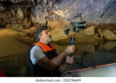 Altınbeşik Cave: Located In Antalya's İbradı (Aydınkent) District, The Cave Has An Exquisite Natural Beauty And Can Be Visited By Inflatable Boats. Cameraman Taking Photos And Videos In The Cave