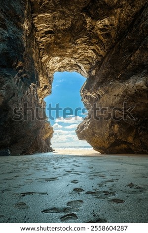 cave on the beech in cornwall england uk 