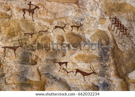 Cave paintings of primitive man. Ocher paint. Hunters hunt deer. Caveman, Neanderthal, drawings in the cave