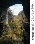 Cave view looking out towards fall foliage and Indian Creek