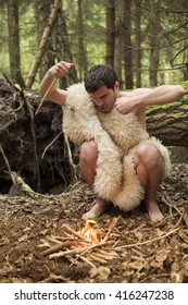 Caveman Produces Fire In The Forest, In The Skin