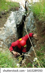 Caver Descends In A Cave. Spelunking Is An Extreme Sport