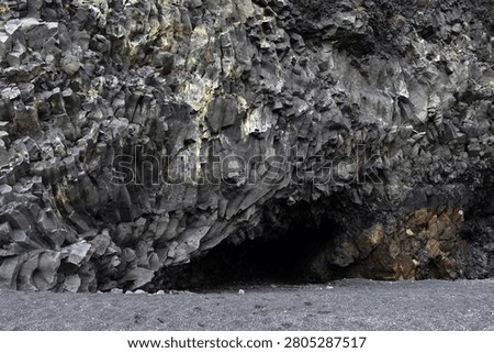 The cavernous opening of Halsanefshellir basalt cave on Reynisfjara beach, Iceland
