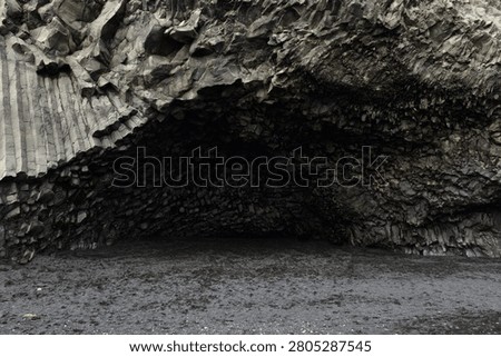 The cavernous opening of Halsanefshellir basalt cave on Reynisfjara beach, Iceland