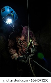 Cavers exploring an uncharted cave