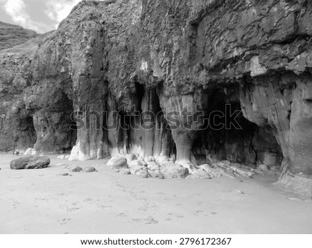 Caves in the limestone cliffs at the sandy beach in Pendine, Carmarthenshire, Wales, UK.