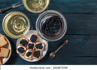 Caviar, Champagne, Luxury Gourmet Food, Vintage Style, Overhead Shot On A Dark Wooden Background With A Place For Text, A Flat Lay