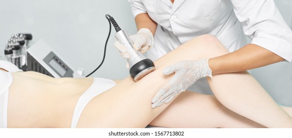 Cavitation Rf Body Treatment. Female Ultra Sound Lipo Machine. Spa Contouring. Doctor Hands.