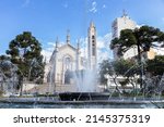 Caxias do Sul, Brazil - Apr 5th, 2022: Fountain at Dante Alighieri Square with the Cathedral in the background