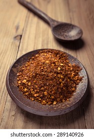 Cayenne Pepper In Ceramic Plates With Spoon