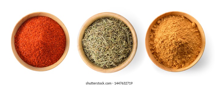 Cayenne pepper, Dried rosemary leaves, Cinnamon Powder in wood bowl on white background - Powered by Shutterstock