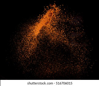 Cayenne Pepper Powder Explosion Isolated On Black Background,Flying Cayenne Pepper,Motion Blur