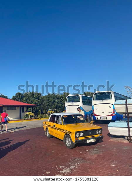 Cayo Santa Maria, Cuba, February 2020: buses and\
taxis in a port parking\
lot