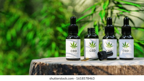 CBD Cannabis OIL. Cannabis Oil In Pipette, Hemp Product. Concept Of Herbal Alternative Medicine, Cbd Oil, Pharmaceutical Industry