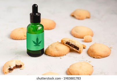CBD Cookies made with CBD oil, a cannabinoid found in cannabis plants. Low levels of THC won't make you feel psychotropic effects as some marijuana strains. Chocolate filling on white background.