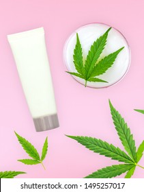 CBD Lotion Gels And Cannabis Leafs Isolated On Pink Background