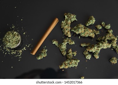 CBD And THC On Buds In Cannabis. Backgroun For Copy Space. Hemp Wraps For Blunt. Cannabis Buds On Black Background. Fresh Marihuana. Hemp Legalisation .