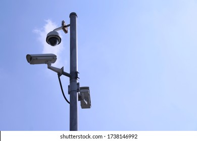 CC.TV cameras installed on steel pole to monitor,record keep evidance for investigation in case of incident happened.Clear blue sky background.Concept of public safety.                            