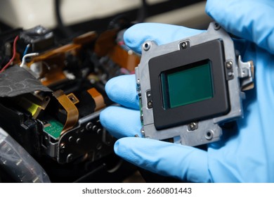 CCD image sensor, the internal imaging component of a DSLR camera, camera repair