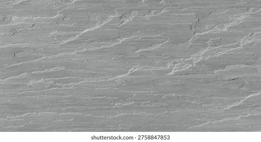 cClose-up of a grey split-face slate stone wall with a natural layered texture and horizontal sedimentary rock patterns.