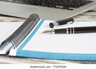 A ccmputer, school helper and a pen