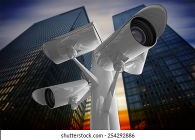 CCTV Camera Against Low Angle View Of Skyscrapers