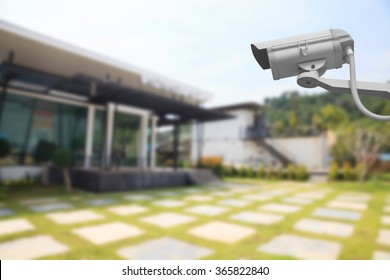 CCTV Camera with house background.