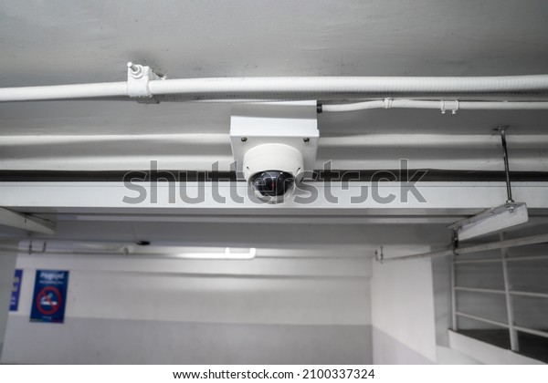 CCTV\
camera is installed on the car parking, ceiling for monitor and\
safety system control in dark low light\
atmosphere.