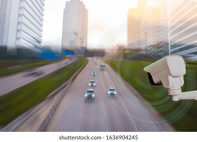 A CCTV Camera New Technology 4.0 Signal For Checking Speed Of Cars On High Way And Check For Safe Accident Are Signal Of Cars Motion Detection Check In City Scape Background.