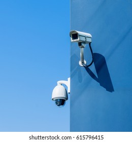 CCTV camera on building blue sky - Shutterstock ID 615796415