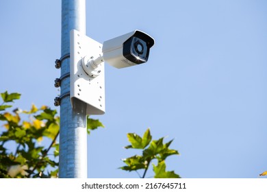 CCTV Camera On A Metal Pole In Park. Public Security Camera. CCTV System In A Public Place. City Video Surveillance System