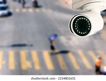 CCTV camera pointing on the road blurred background. artificial intelligence . secutity concept . - Shutterstock ID 2154801631