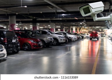 CCTV Camera Security In Parking Garage In The Mall For Background. 