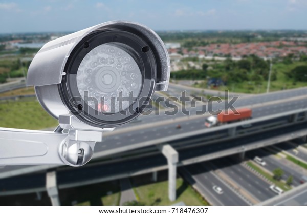 Cctv camera security video record\
electronic technology on traffic road top aerial\
view
