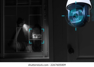 CCTV Camera Showing A Burglar Stealing Things In The House.Smart home security camera on the wall.Cameras work day and night,video recording in the dark.Protection from thieves and vandals. - Powered by Shutterstock