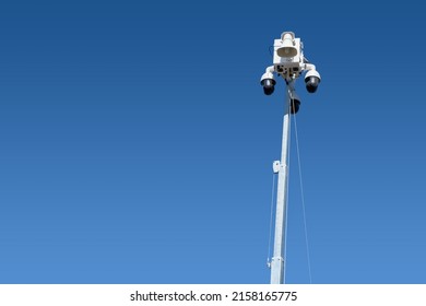 CCTV Camera Towers In The Sky From A Mobile Surveillance Unit In A Parking Lot