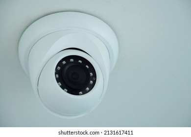 CCTV camera, white CCTV, black lens, for watching movements in the house, office