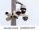 CCTV Cameras in Public Place. Surveillance Video Camera on Pole on Sky Background. Different Types of CCTV Camera Systems. Close up. 