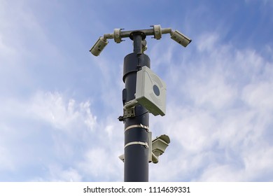 CCTV Cameras And Wifi Station Fitted On Mast On British Countryside.Blue Sky With Clouds In Background.Technology Uk. Surveillance State.Big Brother,Uk.Security Equipment Outdoors.Public Privacy Issue