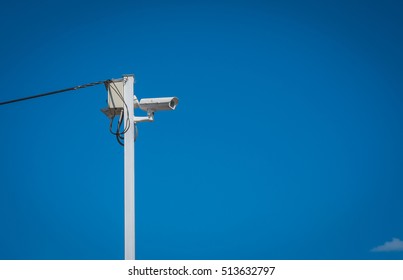 CCTV , Colour picture of surveillance cameras on blue background - Shutterstock ID 513632797