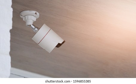 CCTV installed on the ceiling of the building.