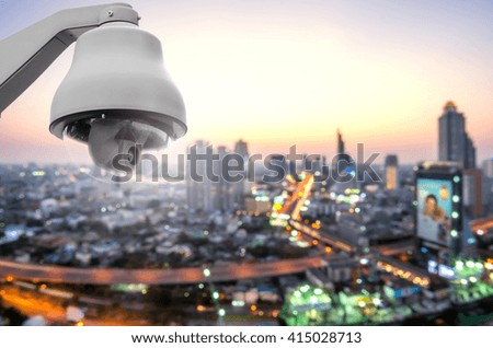 CCTV monitoring, security cameraswith blureed traffic in city at twilight.