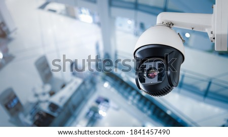 CCTV on Shopping mall or supermarket on blurry background.