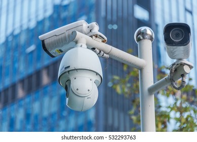 CCTV Security Camera Front Of A Building In City Of China.