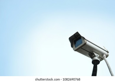 CCTV Security camera on blue sky background, copy space. Surveillance Concept. spy city eye - Shutterstock ID 1082690768