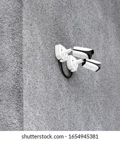 CCTV security camera on a gray wall