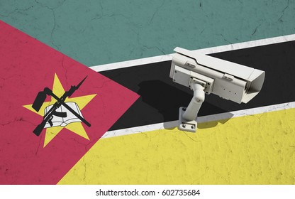 CCTV security camera on wall with painted Mozambique flag background. Concept political relations with neighbors - Powered by Shutterstock - Get 15% off with code: PIKWIZARD15