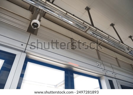 CCTV security camera operating in the metro station 