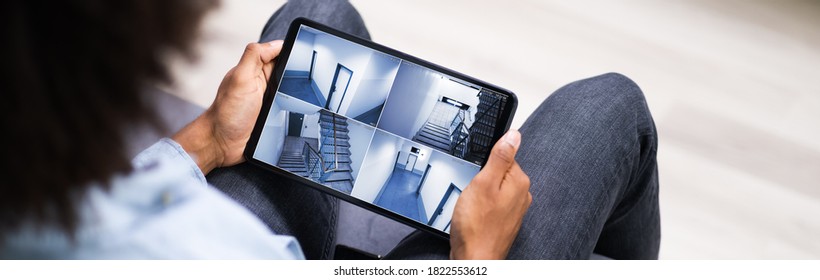 CCTV Security Camera Surveillance Footage On Tablet